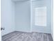 Cozy bedroom with neutral carpet, a large window, and minimalist decor offers a peaceful retreat at 3239 Laurent Loop, Davenport, FL 33837