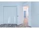 Carpeted bedroom featuring a closet and open doorway to other rooms with modern, minimalist design at 3239 Laurent Loop, Davenport, FL 33837