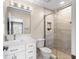 Updated bathroom featuring tile floors, vanity with mirror, and a glass-enclosed shower at 3418 Turningwind Ln, Winter Garden, FL 34787