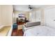 Comfortable bedroom setup with media center, bench seating, and neutral paint at 3418 Turningwind Ln, Winter Garden, FL 34787