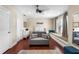 Spacious bedroom featuring a ceiling fan, a pull-out sofa, and a window bench with cushioned seating at 3418 Turningwind Ln, Winter Garden, FL 34787