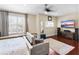 Inviting bedroom with ample seating, a media center, and two window benches at 3418 Turningwind Ln, Winter Garden, FL 34787