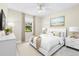 Comfortable bedroom featuring neutral tones, a window, and stylish furniture at 3418 Turningwind Ln, Winter Garden, FL 34787