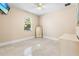 Empty bedroom showcasing bright and open space, ceiling fan, and window at 3418 Turningwind Ln, Winter Garden, FL 34787