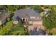 A beautiful aerial view of this two-story home, landscaped yard, and attached two car garage at 3418 Turningwind Ln, Winter Garden, FL 34787