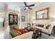 Bright living room featuring tile flooring, crown molding, and a decorative front door at 3418 Turningwind Ln, Winter Garden, FL 34787