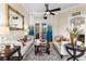 Comfortable living room with stylish furnishings, tile flooring, and views of the outdoor patio at 3418 Turningwind Ln, Winter Garden, FL 34787