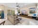 Bright living room with large sectional sofa, modern entertainment center, and neutral decor at 3418 Turningwind Ln, Winter Garden, FL 34787