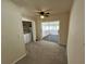 Bedroom with sliding glass door to sunroom and a closet with washer and dryer at 3530 Forest Branch Dr # F, Port Orange, FL 32129