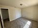 Cozy bedroom with neutral color palette, carpeted floor and closet at 3530 Forest Branch Dr # F, Port Orange, FL 32129