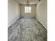 Neutral bedroom with a window and carpeted floors at 3530 Forest Branch Dr # F, Port Orange, FL 32129