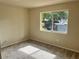 Cozy bedroom with a large window offering natural light and soft carpeting for added comfort at 3530 Forest Branch Dr # F, Port Orange, FL 32129