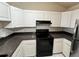 Kitchen featuring stainless steel appliances, white cabinetry and tile floor at 3530 Forest Branch Dr # F, Port Orange, FL 32129