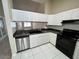 Open Kitchen with stainless steel appliances, tile floors and ample counterspace at 3530 Forest Branch Dr # F, Port Orange, FL 32129