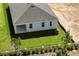 Aerial view of the home showcasing the backyard, roof, and proximity to landscaping at 364 Lemongrass Rd, Minneola, FL 34715