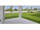 Well-maintained backyard with green lawn, privacy fence, and small trees at 364 Lemongrass Rd, Minneola, FL 34715
