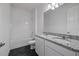 Elegant bathroom featuring double sinks, granite countertops, and a shower and bath at 364 Lemongrass Rd, Minneola, FL 34715