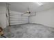 Spacious garage with concrete floor and ample room for storage at 364 Lemongrass Rd, Minneola, FL 34715