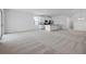 Open-concept living space with carpet at 364 Lemongrass Rd, Minneola, FL 34715