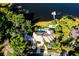 Magnificent aerial perspective of the property featuring the expansive estate and waterfront setting at 4 Island Dr, Lake Mary, FL 32746