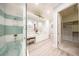 Spa-like bathroom with jacuzzi tub, dual vanities, and a door to the large walk-in closet at 4 Island Dr, Lake Mary, FL 32746