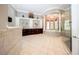 Luxury bathroom with dual vanities, a soaking tub, and a glass-enclosed shower at 4 Island Dr, Lake Mary, FL 32746