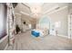 Bright bedroom with a tray ceiling, plush carpet, and decorative coastal bedding at 4 Island Dr, Lake Mary, FL 32746
