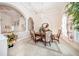 This dining room showcases an elegant chandelier, a decorative rug inlay and custom window treatments at 4 Island Dr, Lake Mary, FL 32746