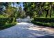 Elegant driveway with a decorative inlay leading to the grand estate at 4 Island Dr, Lake Mary, FL 32746