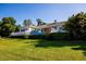 Well-maintained exterior of the home with a manicured lawn and hedges at 4 Island Dr, Lake Mary, FL 32746