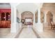 Spacious foyer with tile flooring, grand columns, and intricate ceiling design, leading to living spaces at 4 Island Dr, Lake Mary, FL 32746