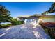 Charming home with a two car garage, brick driveway, and beautifully manicured landscaping at 4 Island Dr, Lake Mary, FL 32746