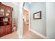 Hallway view leading to a bedroom featuring tile floors and neutral wall colors at 4 Island Dr, Lake Mary, FL 32746