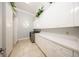 Bright laundry room with tiled floors, sleek countertops, and ample storage space at 4 Island Dr, Lake Mary, FL 32746
