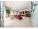 Bright living room with tile floors, built-in shelves, and a large sectional sofa at 4 Island Dr, Lake Mary, FL 32746