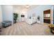 Spacious main bedroom with light-blue walls, white trim, neutral carpet, and a doorway to the bathroom at 4 Island Dr, Lake Mary, FL 32746
