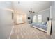 Expansive main bedroom with neutral walls and carpet, ceiling fan, and comfortable seating at 4 Island Dr, Lake Mary, FL 32746