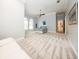 Spacious main bedroom with neutral-colored walls, carpet, and a seating area at 4 Island Dr, Lake Mary, FL 32746