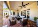 Spacious covered patio with comfortable seating and ceiling fans, perfect for outdoor living at 4 Island Dr, Lake Mary, FL 32746