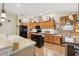 Well-lit kitchen featuring ample cabinetry, modern appliances, and a functional center island at 433 Arcadia Lakes Dr, The Villages, FL 32162