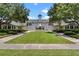 Beautiful community clubhouse with a well-manicured lawn and landscaping at 4350 New Broad St, Orlando, FL 32814