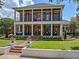Stately two-story home featuring classic Southern architecture with prominent white columns and manicured landscaping at 4350 New Broad St, Orlando, FL 32814