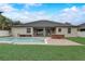 Inviting backyard pool with a brick patio and ample space for lounging and entertaining at 440 Skyview Pl, Chuluota, FL 32766