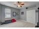 Spare bedroom with closet, carpet, ceiling fan, and light grey walls at 440 Skyview Pl, Chuluota, FL 32766