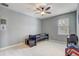 Cozy, carpeted bedroom with a ceiling fan, window, and a small toddler bed at 440 Skyview Pl, Chuluota, FL 32766