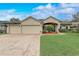 Charming single-story home featuring a brick driveway, three-car garage, and well-manicured lawn at 440 Skyview Pl, Chuluota, FL 32766