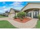 Beautiful home with a brick walkway, lush landscaping, and a well-maintained three-car garage at 440 Skyview Pl, Chuluota, FL 32766