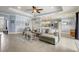 Bright living room with modern furniture and archway to the kitchen at 440 Skyview Pl, Chuluota, FL 32766