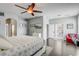 Spacious main bedroom features hardwood floors, ceiling fan, recessed lighting and lots of natural light at 440 Skyview Pl, Chuluota, FL 32766