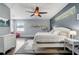 Spacious main bedroom features hardwood floors, ceiling fan, and natural light at 440 Skyview Pl, Chuluota, FL 32766